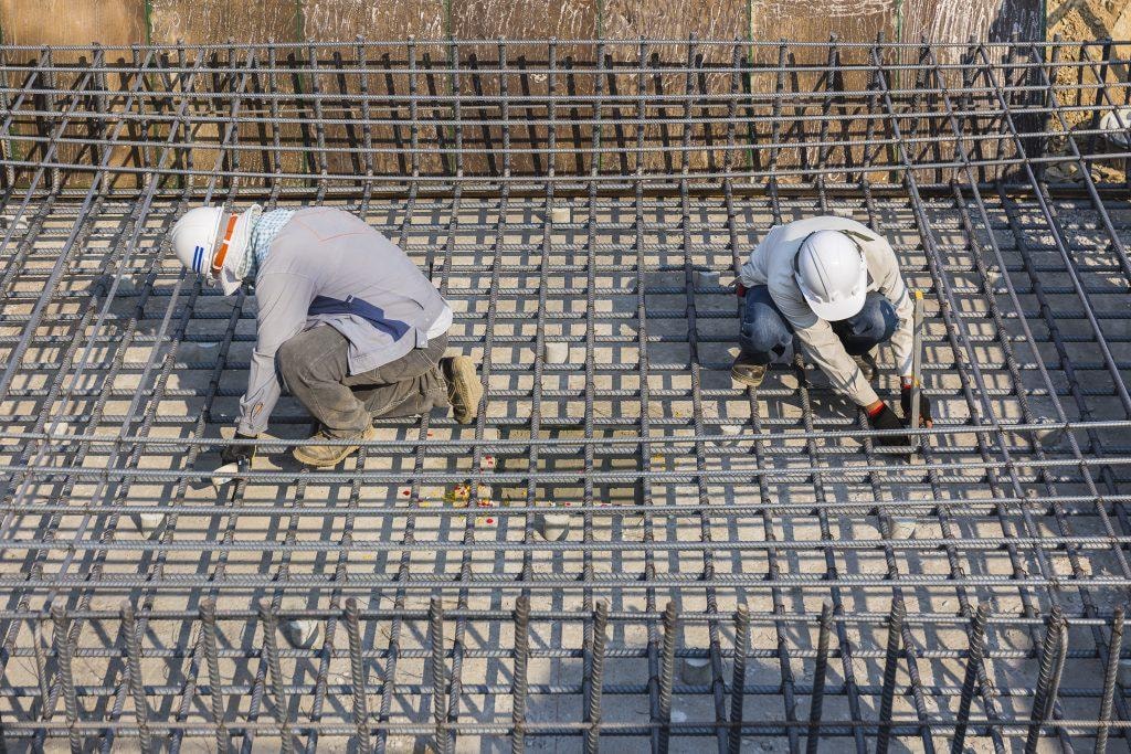 First Gen Construction workers on reinforced concrete structure